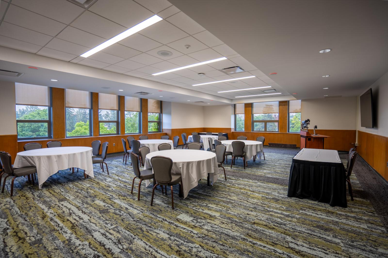 Lake Superior Room with tables, chairs, table cloths and technology