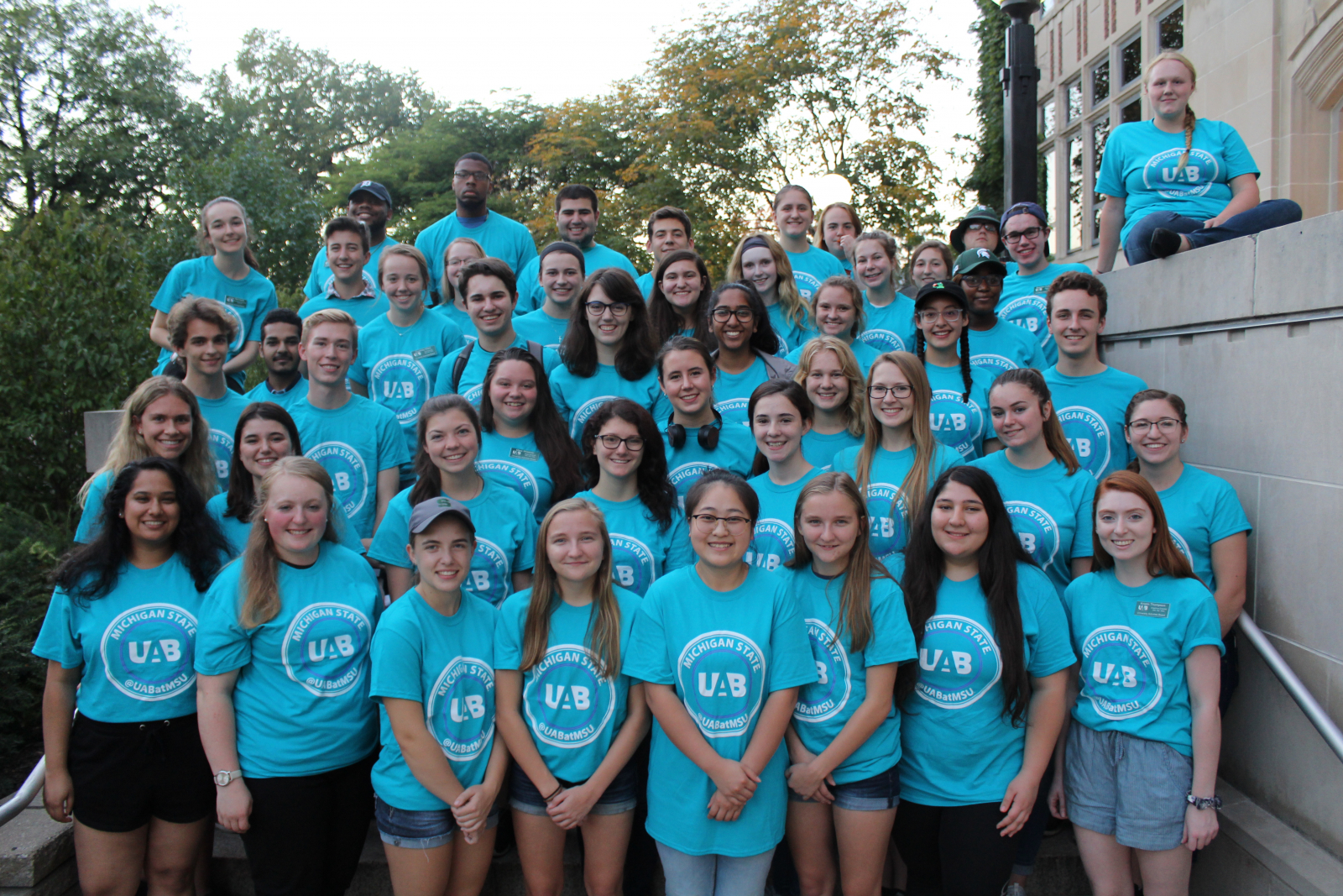 group of students in blue shirts